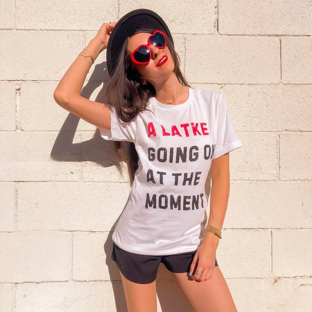 Elaine Chaya wearing the A Latke Going On at the Moment Hanukkah T-shirt.