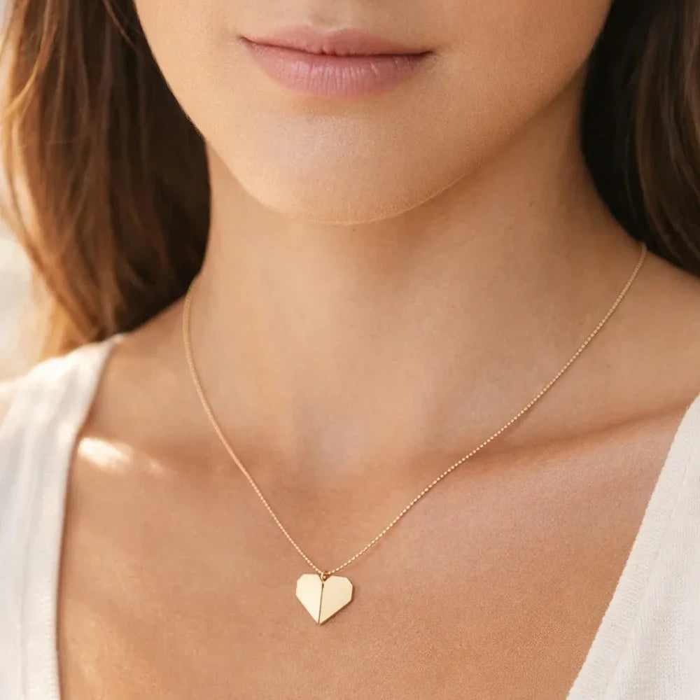 Adult Tiny Origami Heart Necklace worn by a woman