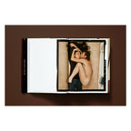 Annie Leibovitz photography book open to her 1980 portrait of John Lennon and Yoko Ono