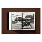 Annie Leibovitz photography book open to a black-and-white photograph of a presidential helicopter landing at the White House
