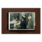 Annie Leibovitz photography book open to her 2006 portrait of Sharon Stone, Anjelica Huston, and Diane Lane