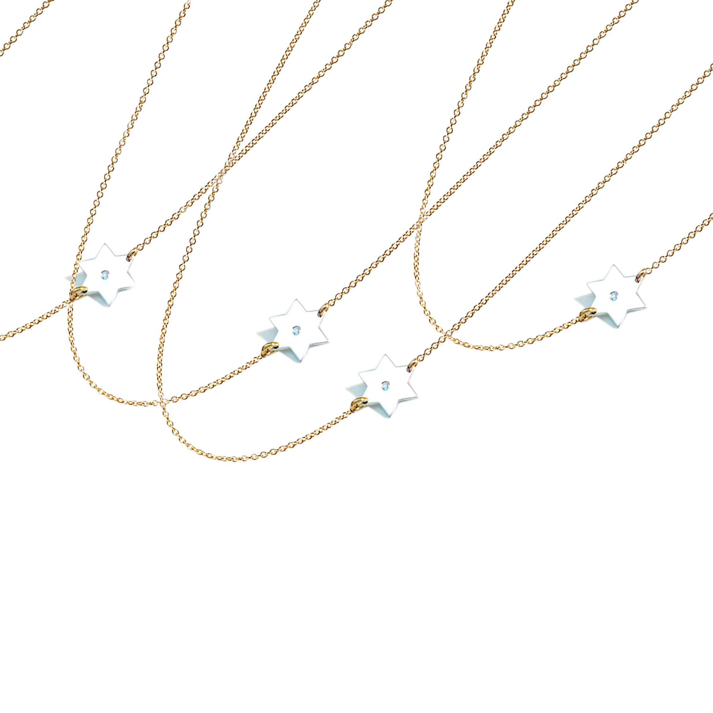 Asymmetrical Diamond Star of David necklaces styled in two-tone finish