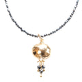 Beaded Pomegranate Necklace with hematite beads and gold pomegranate pendant from the Israel Museum