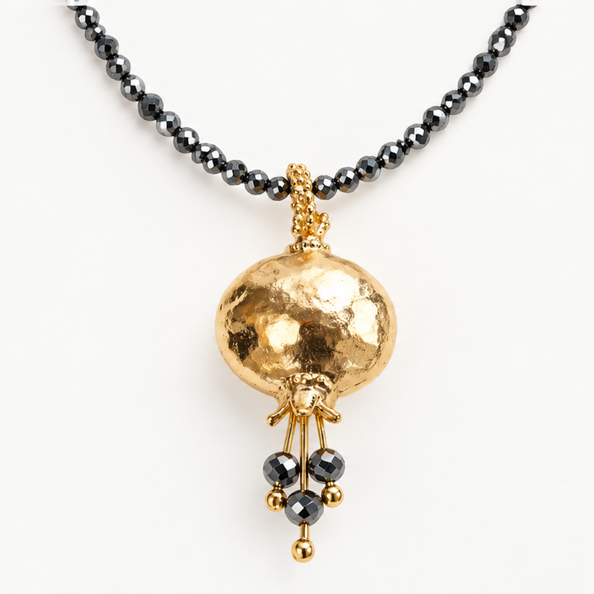 Beaded Pomegranate Necklace with hematite beads and gold pomegranate pendant from the Israel Museum