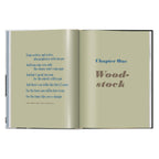Bob Dylan A Year and a Day book open to The Times They Are A-Changin' lyrics and the Woodstock chapter