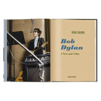 Daniel Kramer photograph of Bob Dylan recording with electric guitar beside the A Year and a Day title page