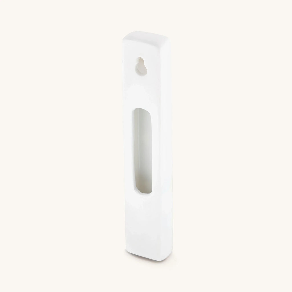 Back of white Bright Beginnings ceramic mezuzah case showing space for a scroll