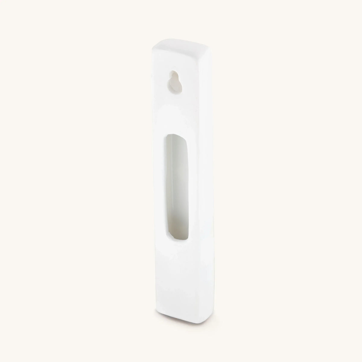 Back of white Bright Beginnings ceramic mezuzah case showing space for a scroll