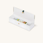 Bright Beginnings rainbow ceramic mezuzah presented inside an open gift box