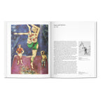 Chagall art book open to a Marc Chagall painting with figures and vivid color