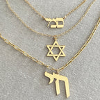 Gold Chai necklace layered with Star of David and Hebrew jewelry