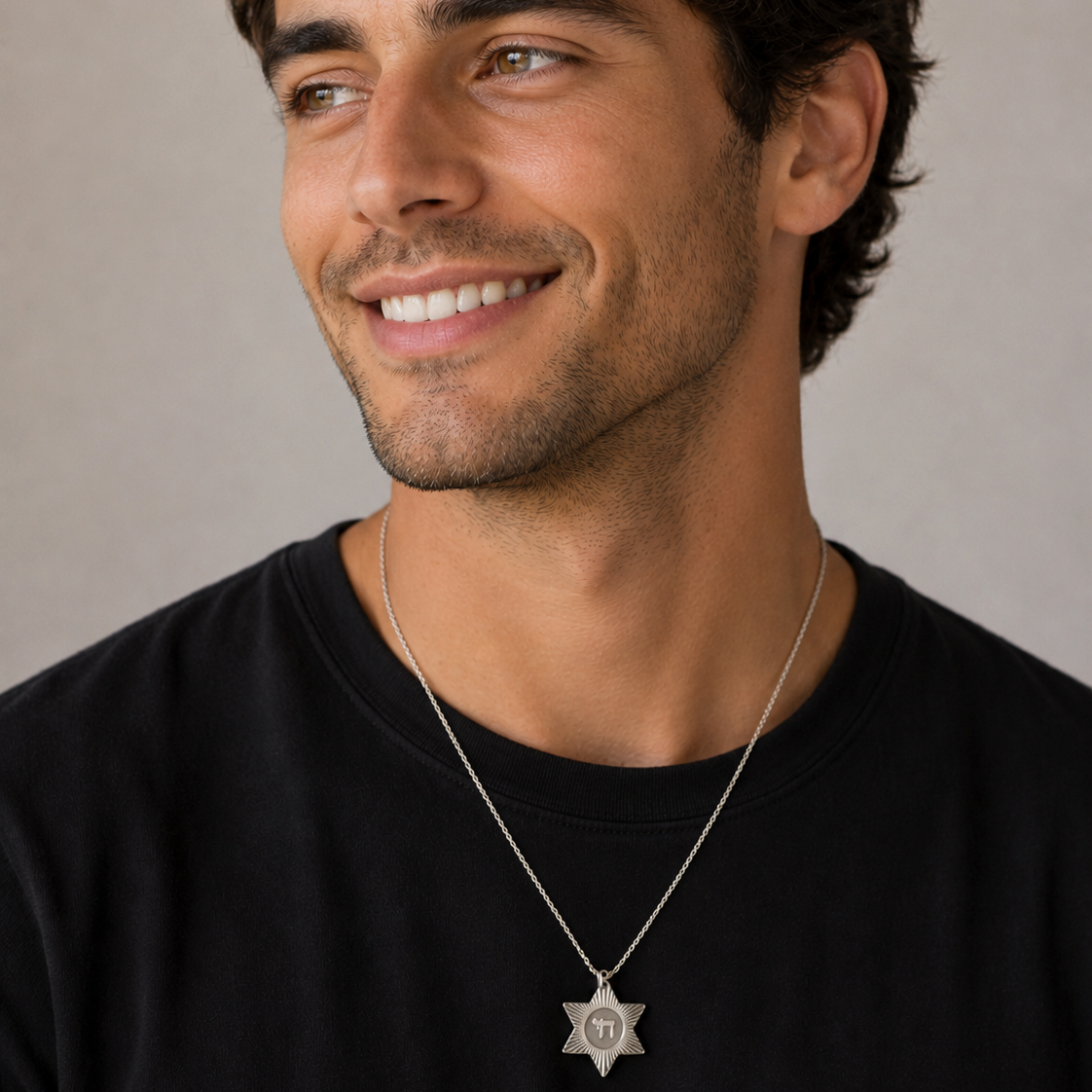 Man wearing sterling silver Chai Star of David medallion necklace