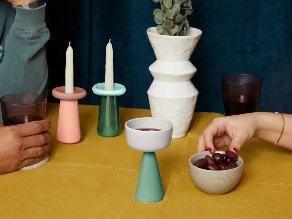 Colorful Cone Kiddush Cups arranged on a Shabbat table by Tchotchke