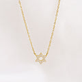 Gold-plated Crystal Set Star of David Necklace by Shlomit Ofir, featuring a petite Magen David pendant with clear crystals on a delicate chain.