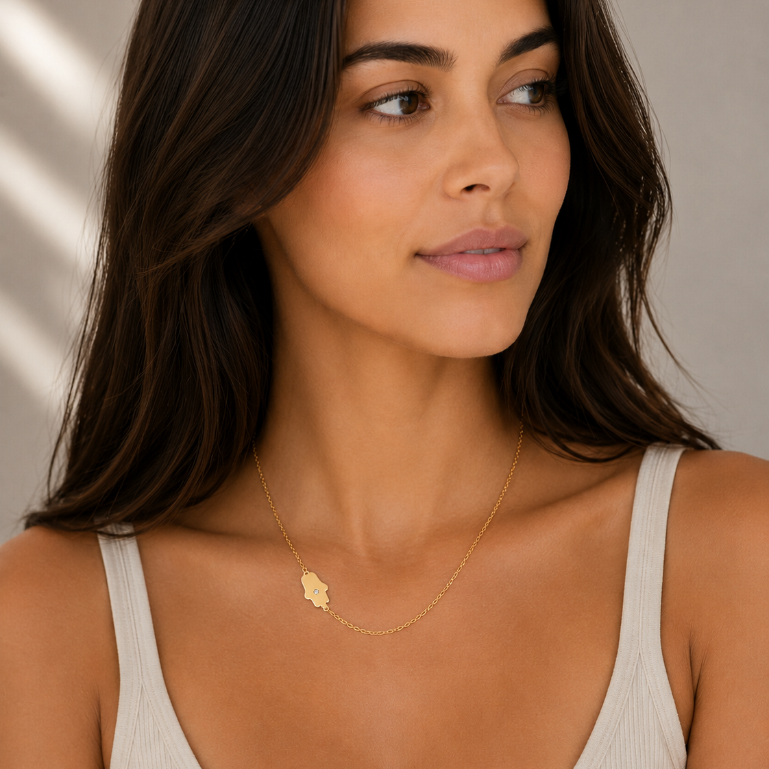 Asymmetrical Diamond Hamsa Necklace worn by a woman