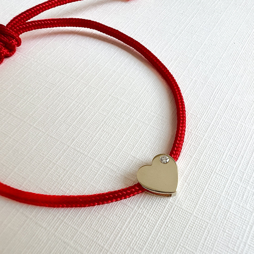Close-up of 14K gold heart charm on Diamond Heart Fortune Bracelet
