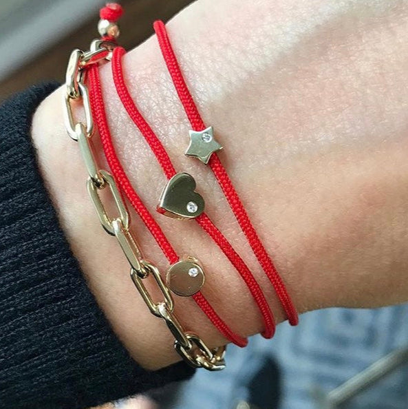 Diamond Heart Fortune Bracelet worn in a layered bracelet stack