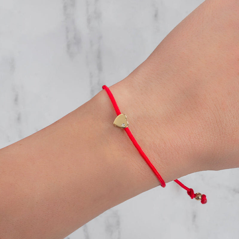 Diamond Heart Fortune Bracelet with red cord worn on wrist