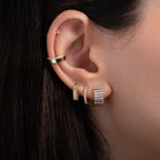 Diamond Huggie Earring worn in a layered ear stack