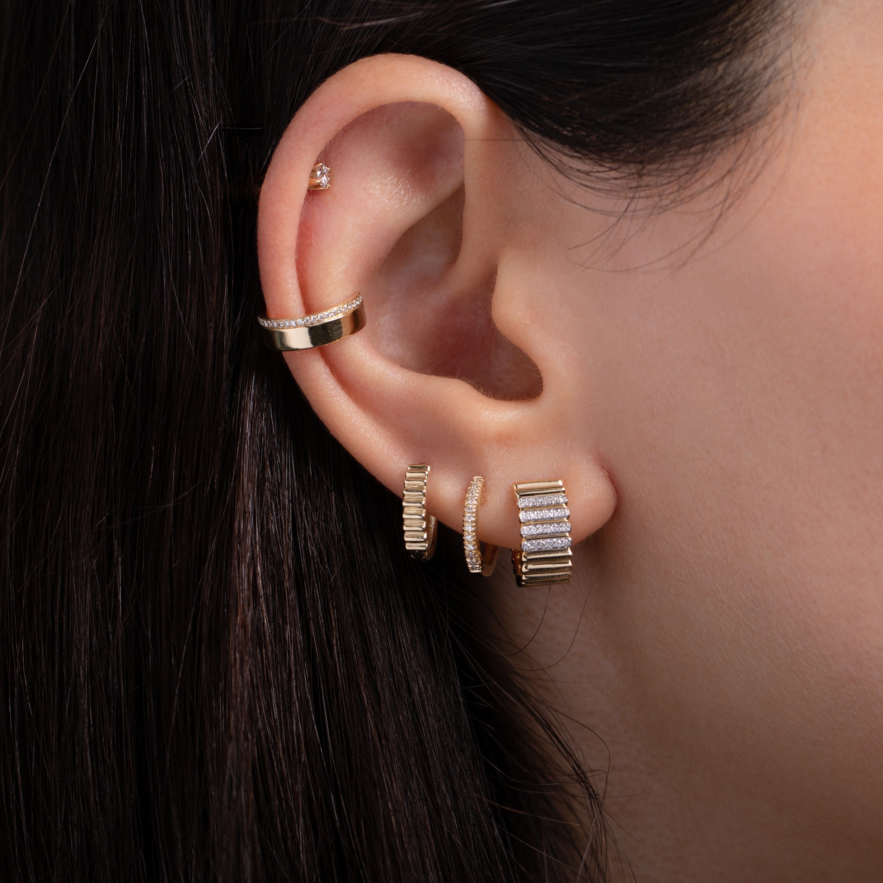 Diamond Huggie Earring worn in a layered ear stack