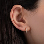 Diamond Huggie Earrings worn on ear