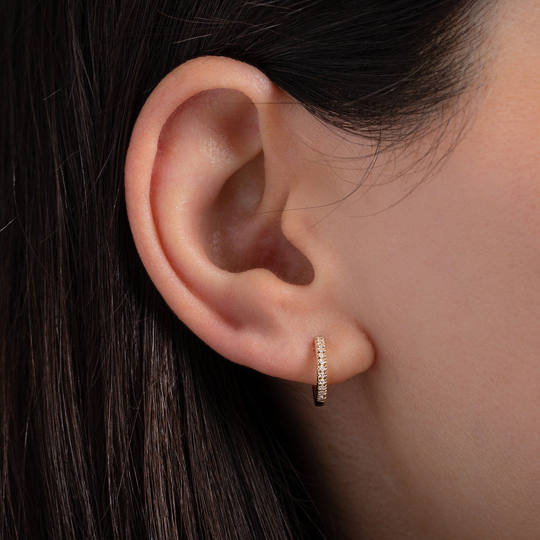 Diamond Huggie Earrings worn on ear
