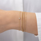 Tiny Diamond Star of David Bracelet worn in a delicate bracelet stack