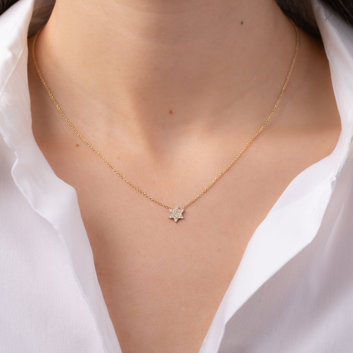 Diamond Star of David Necklace worn at the collarbone