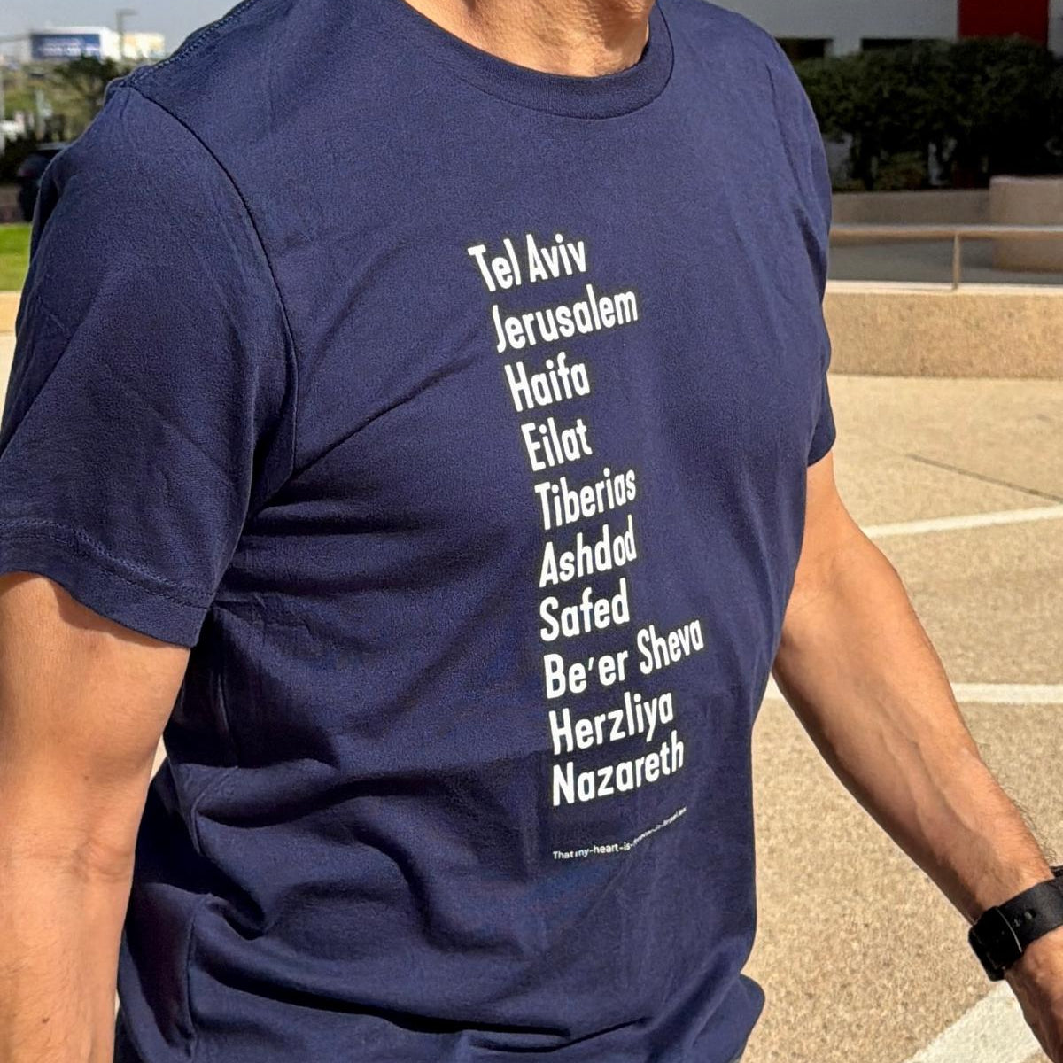 Eitan Chitayat wearing The Ten Israeli Cities T-Shirt in Tel Aviv