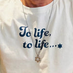 Eitan Chitayat wearing the To Life, To Life T-Shirt