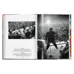 Alfred Wertheimer photograph of Elvis Presley performing before a crowd at Russwood Park in Memphis