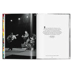 Alfred Wertheimer photograph of Elvis Presley performing on Stage Show in March 1956 beside a New York Times quote