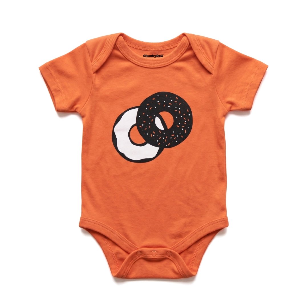 Everything Bagel baby bodysuit in orange with bagel graphic, alternate view