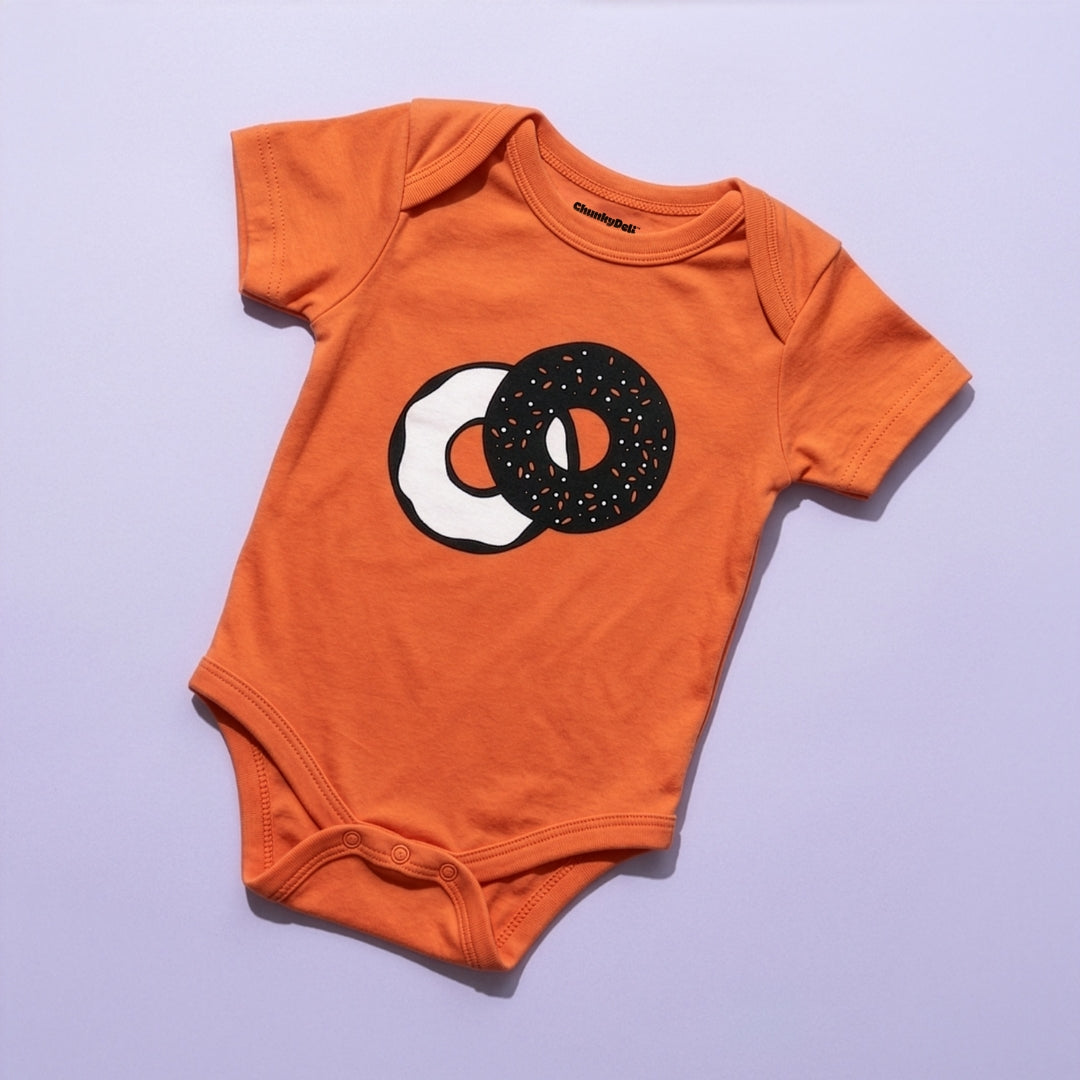 Orange Everything Bagel baby bodysuit by Chunky Deli, product view