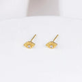 Gold-plated Evie Post Earrings by Shlomit Ofir, featuring delicate eye-shaped studs with clear cubic zirconia accents.