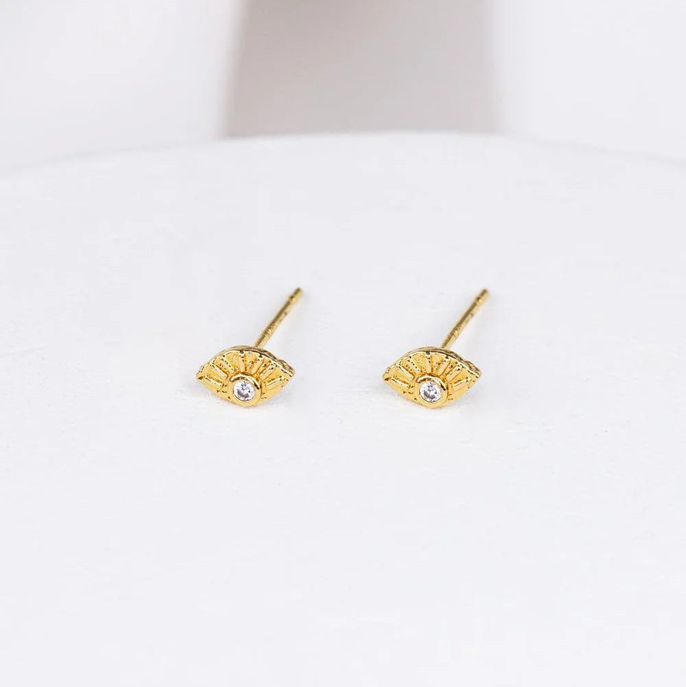 Gold-plated Evie Post Earrings by Shlomit Ofir, featuring delicate eye-shaped studs with clear cubic zirconia accents.