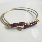 Mozambique garnet gemstone and brass bangle by Sara Sela