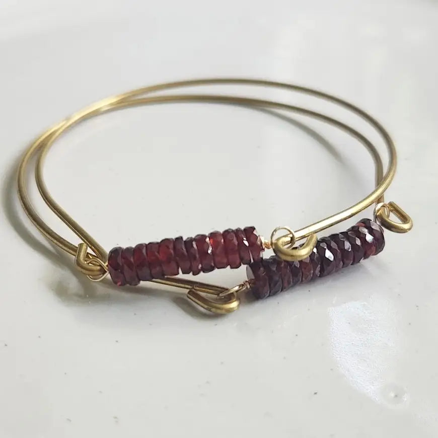Mozambique garnet gemstone and brass bangle by Sara Sela