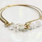 Quartz gemstone and brass bangle by Sara Sela