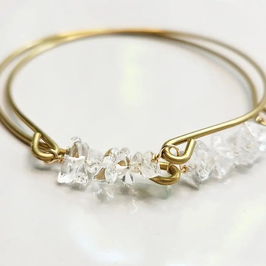 Quartz gemstone and brass bangle by Sara Sela