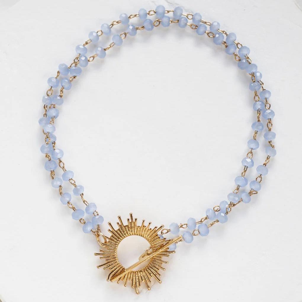 Blue Glory Bracelet with gold starburst pendant by Shlomit Ofir