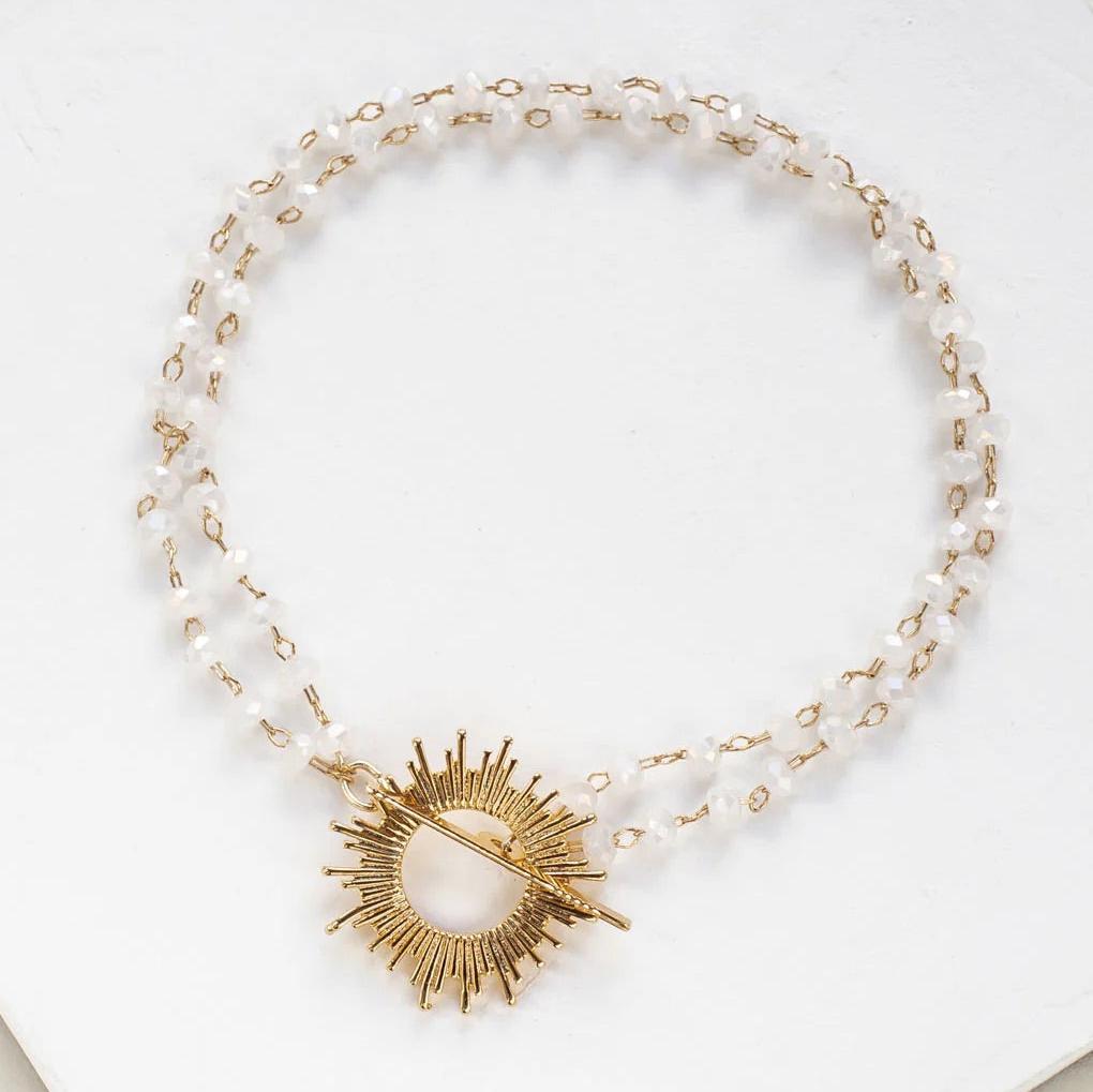 White Glory Bracelet with gold starburst pendant by Shlomit Ofir