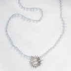 Light blue Glory Necklace with silver starburst pendant by Shlomit Ofir
