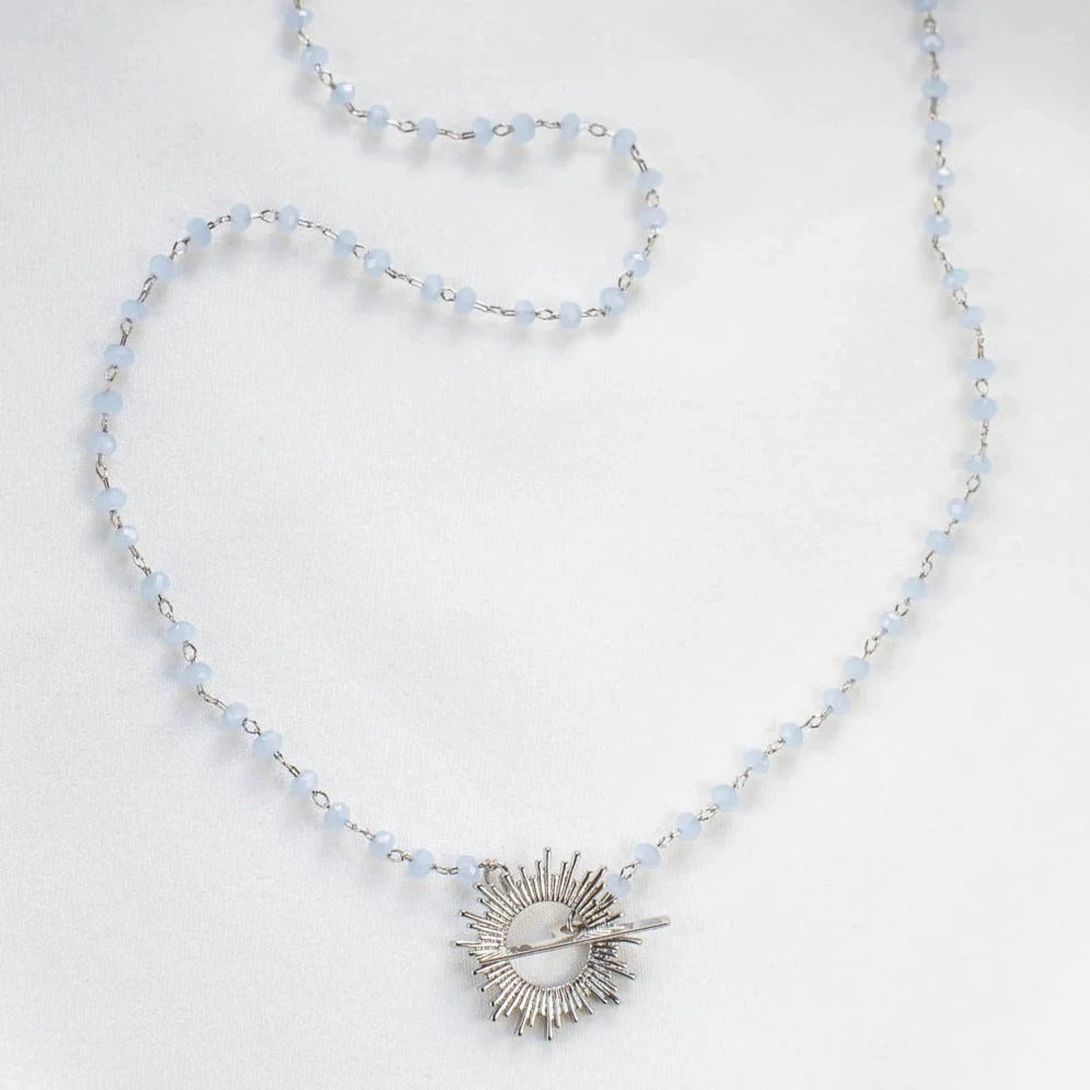 Light blue Glory Necklace with silver starburst pendant by Shlomit Ofir