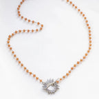 Orange Glory Necklace with silver starburst pendant by Shlomit Ofir