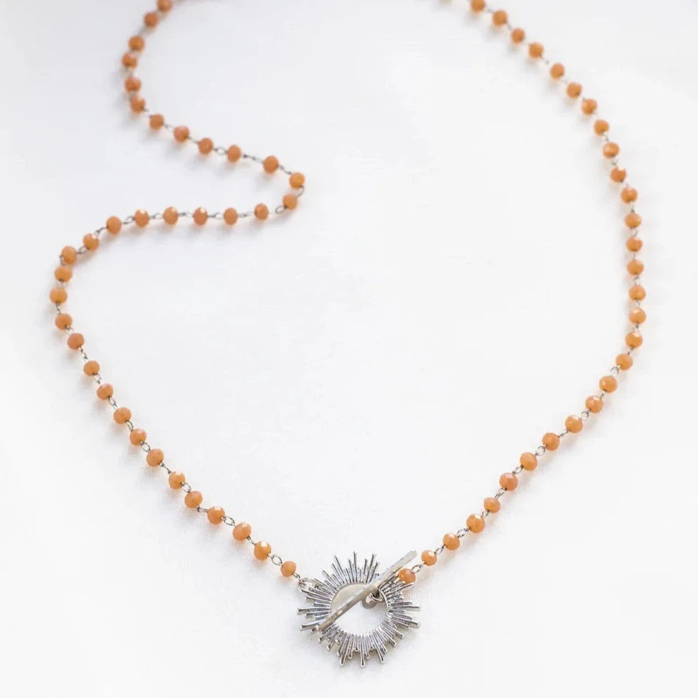 Orange Glory Necklace with silver starburst pendant by Shlomit Ofir