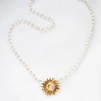 White Glory Necklace with gold starburst pendant by Shlomit Ofir