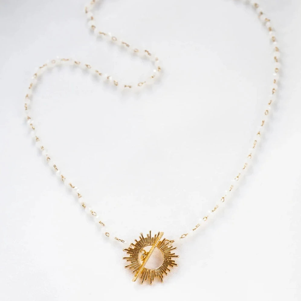 White Glory Necklace with gold starburst pendant by Shlomit Ofir