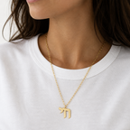 Gold Chai Paperclip Necklace worn by a woman