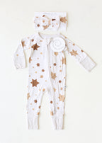 Golden Hour Hanukkah baby bow with matching neutral Star of David pajamas by Shiloh & Kate.